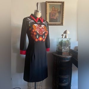 Black dress with embroidered pug dog design